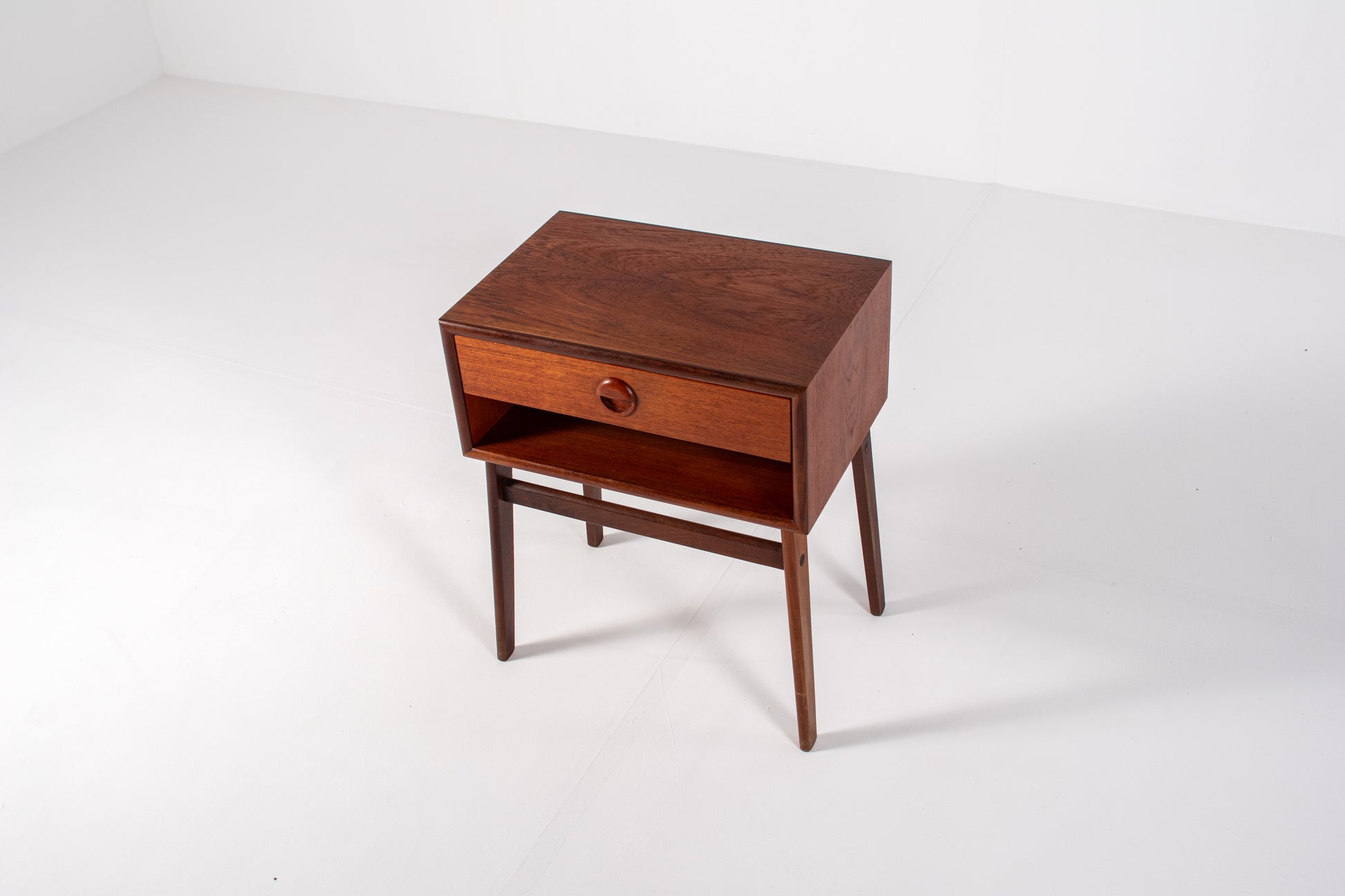 Vintage Danish teak nightstand with tapered legs and single drawer